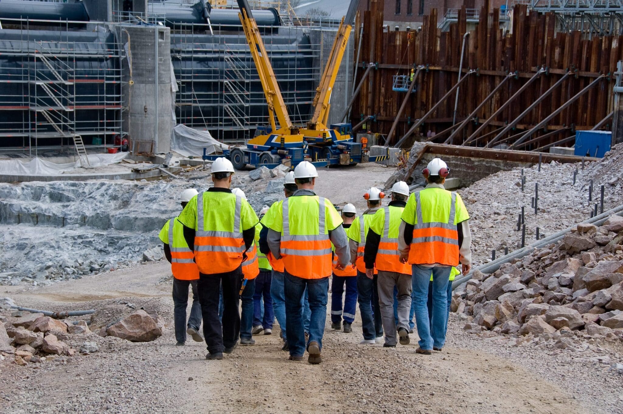 Rear shot of a group of workers on a job site.