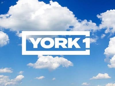 YORK1 logo over image of blue sky and clouds.