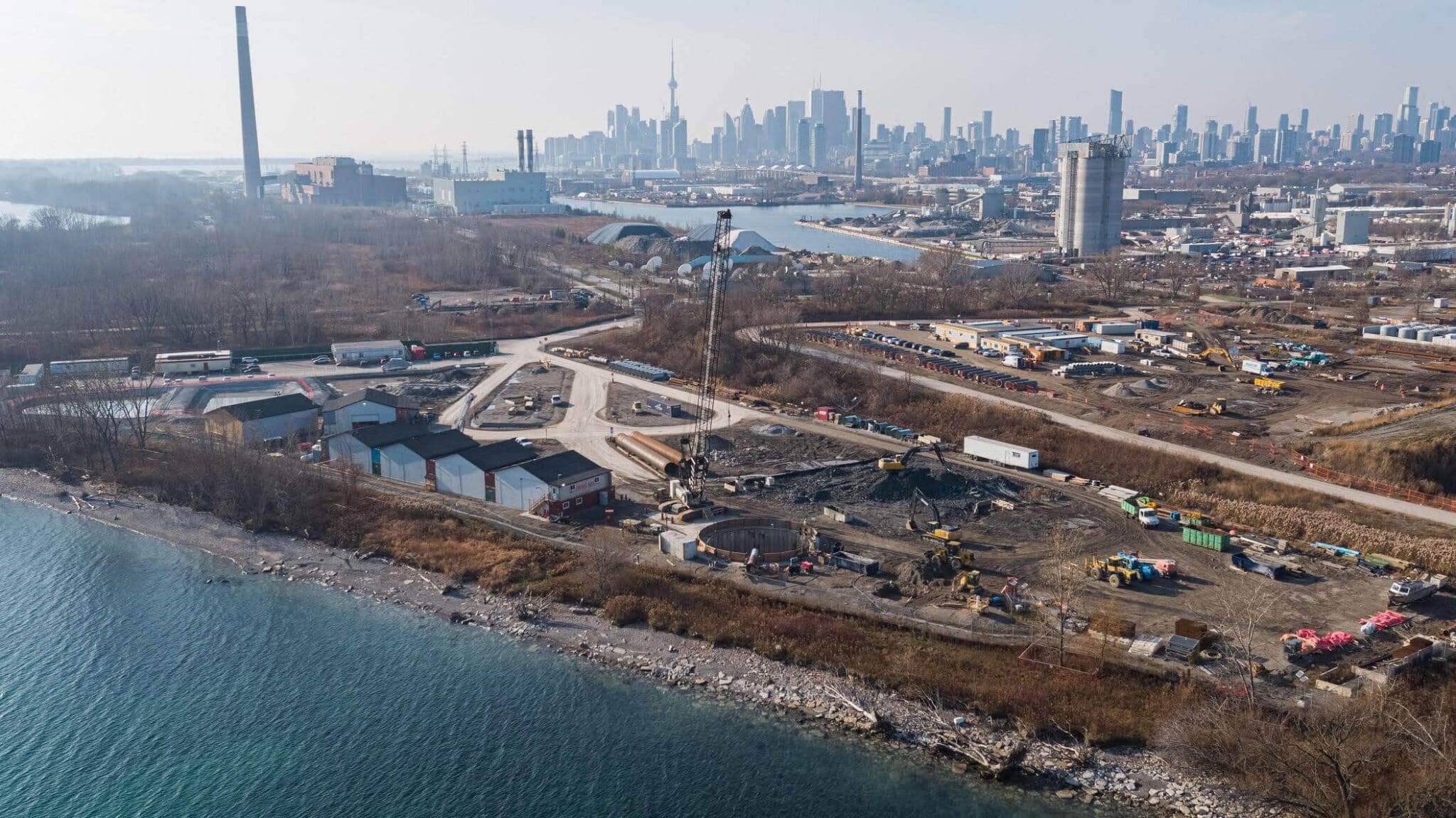 Overhead shot of job site at Ashbridges Bay, Toronto skyline in background.