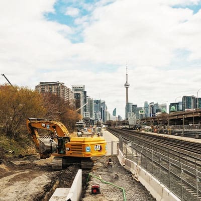 Excavation work for Metrolinx with the Toronto skyline in the background