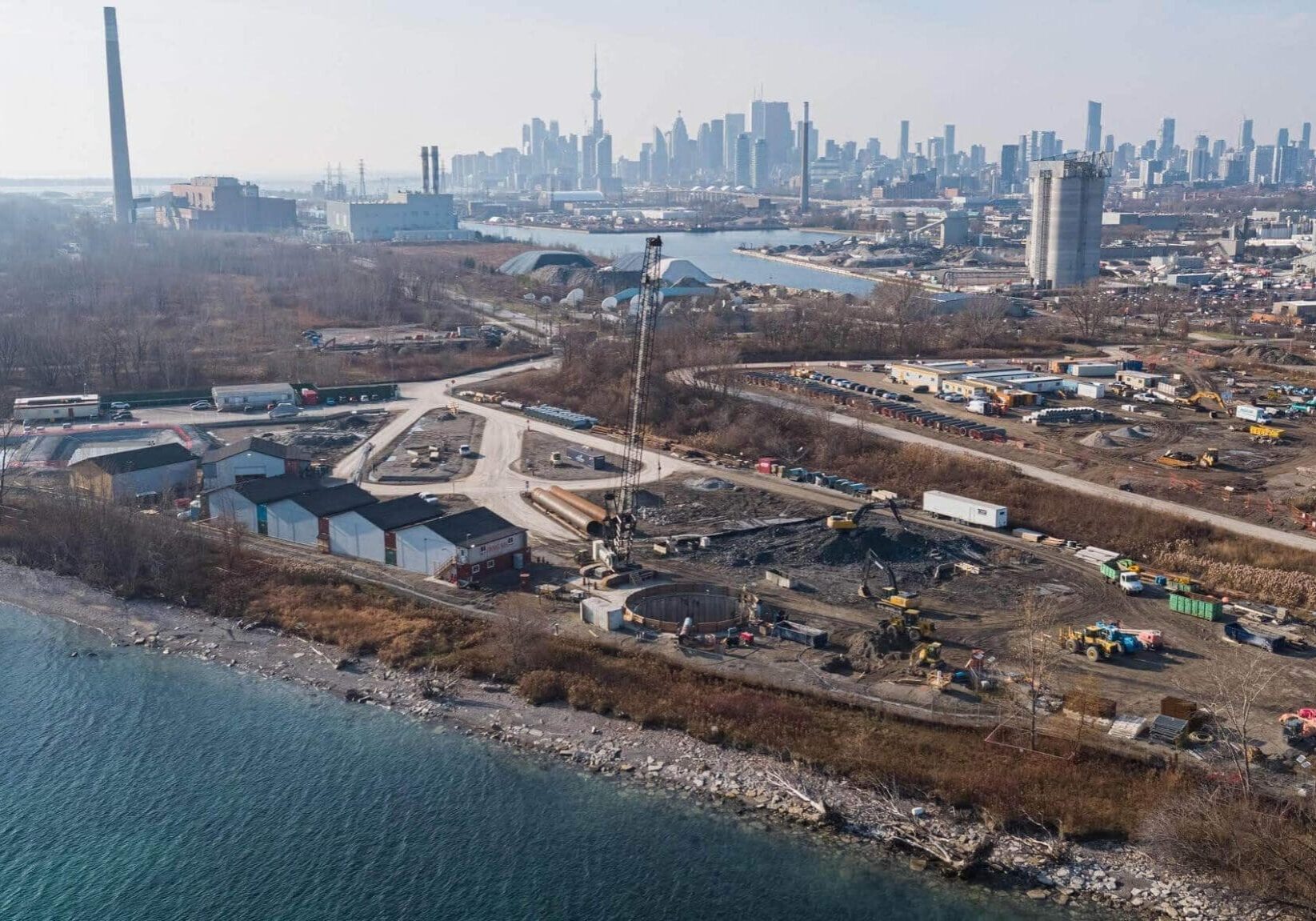 Overhead shot of job site at Ashbridges Bay, Toronto skyline in background.